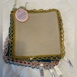 Set of six linen cocktail napkins featuring red